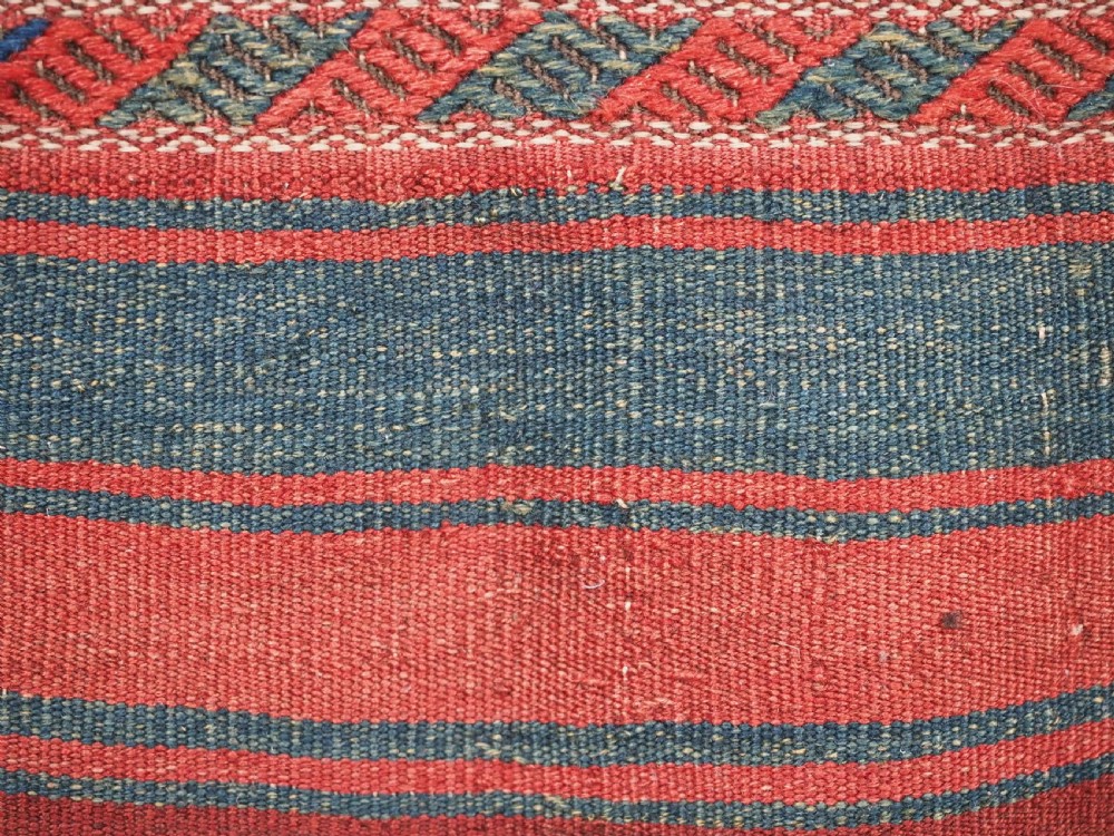 An antique Kurdish Jaf tribal bag featuring a hand-knotted diamond geometric pattern on the front and a striped plain weave backing in red, blue, and teal shades. View VIII