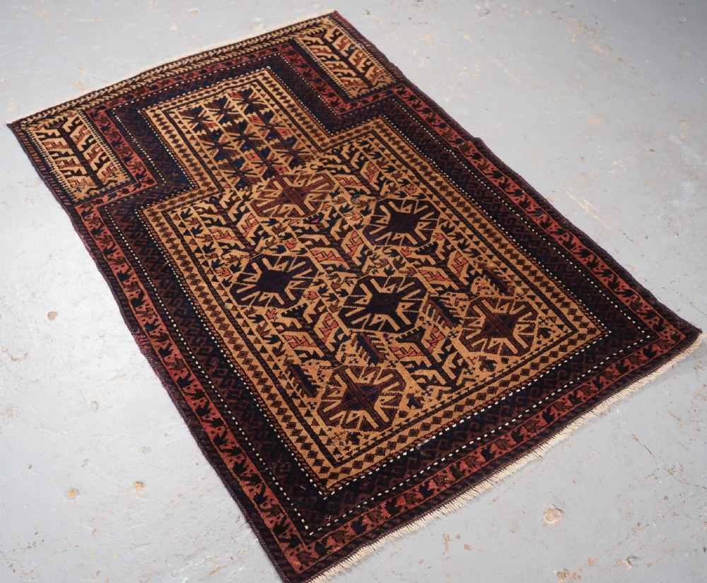 ANTIQUE TIMURI BALUCH PRAYER RUG, CAMEL GROUND, CIRCA 1880. View II