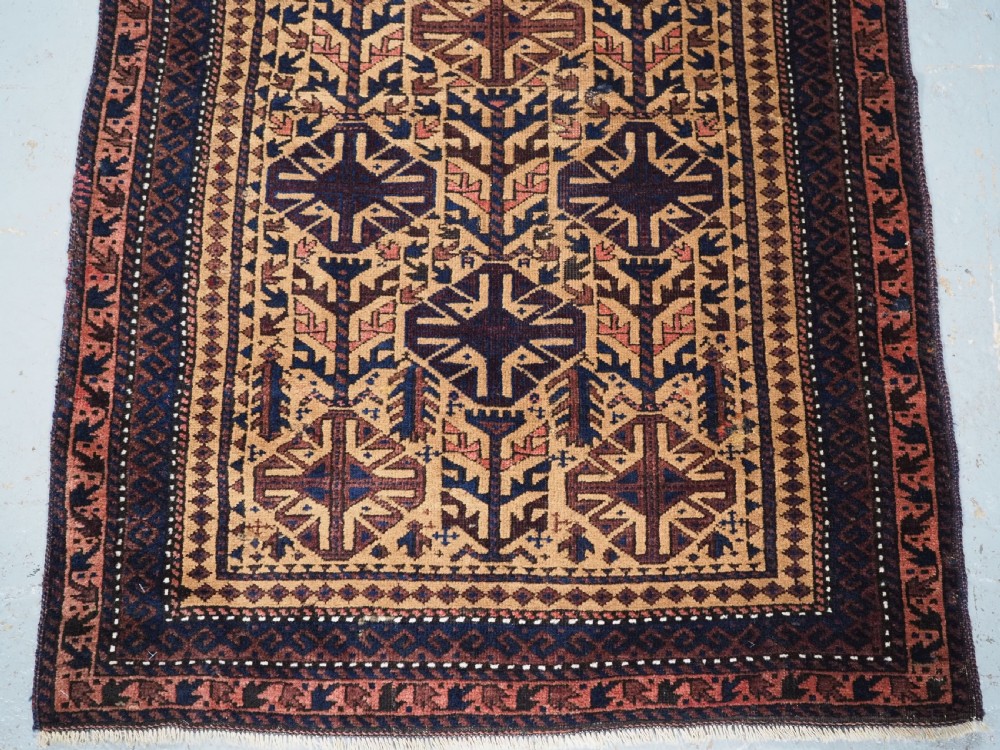 ANTIQUE TIMURI BALUCH PRAYER RUG, CAMEL GROUND, CIRCA 1880. View IV