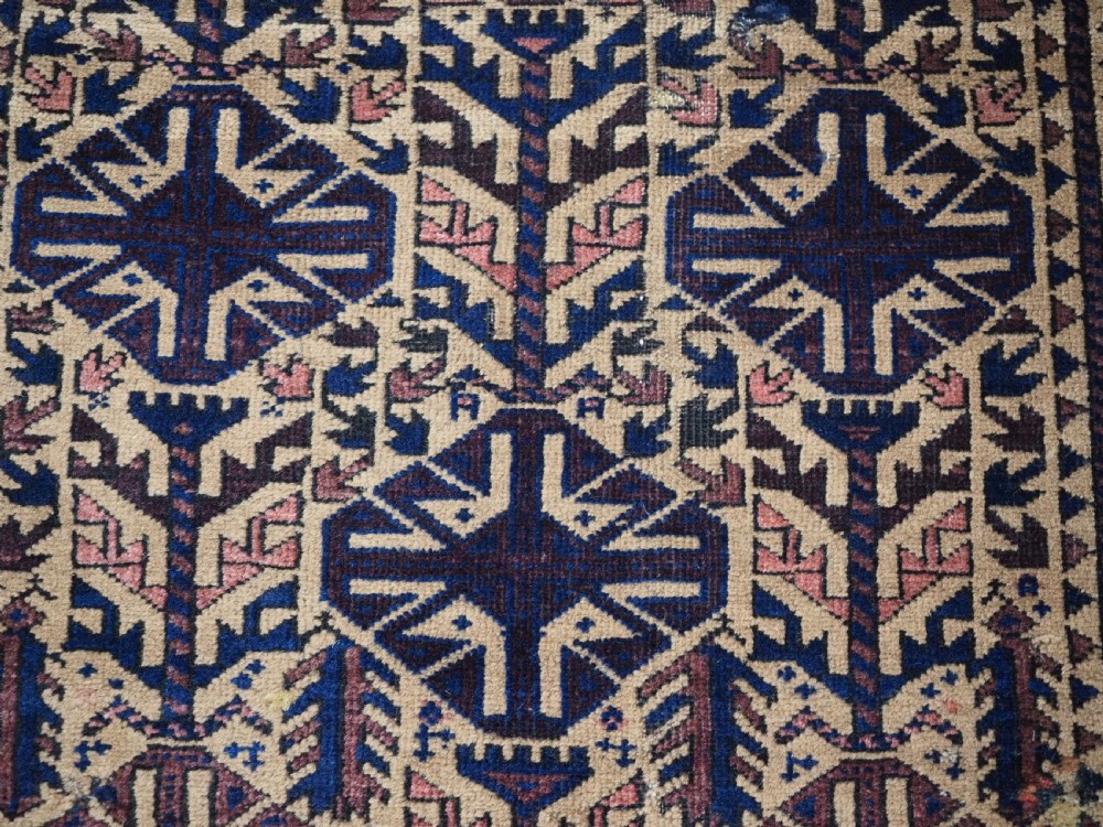 ANTIQUE TIMURI BALUCH PRAYER RUG, CAMEL GROUND, CIRCA 1880. View VIII
