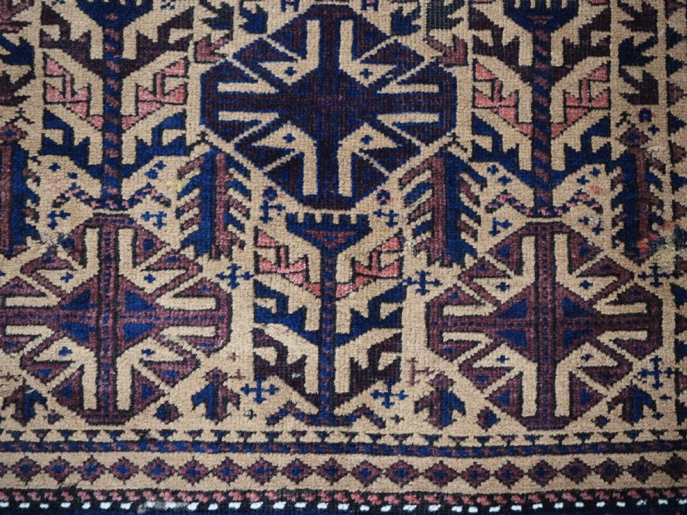 ANTIQUE TIMURI BALUCH PRAYER RUG, CAMEL GROUND, CIRCA 1880. View IX