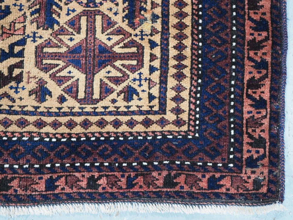 ANTIQUE TIMURI BALUCH PRAYER RUG, CAMEL GROUND, CIRCA 1880. View X