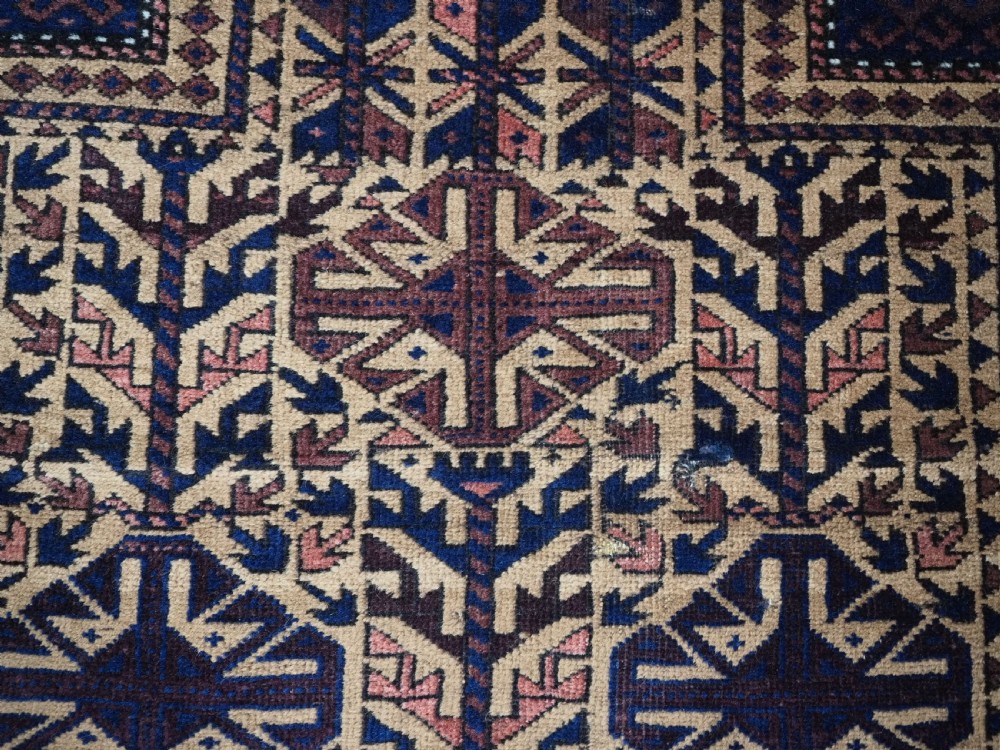 ANTIQUE TIMURI BALUCH PRAYER RUG, CAMEL GROUND, CIRCA 1880. View XII