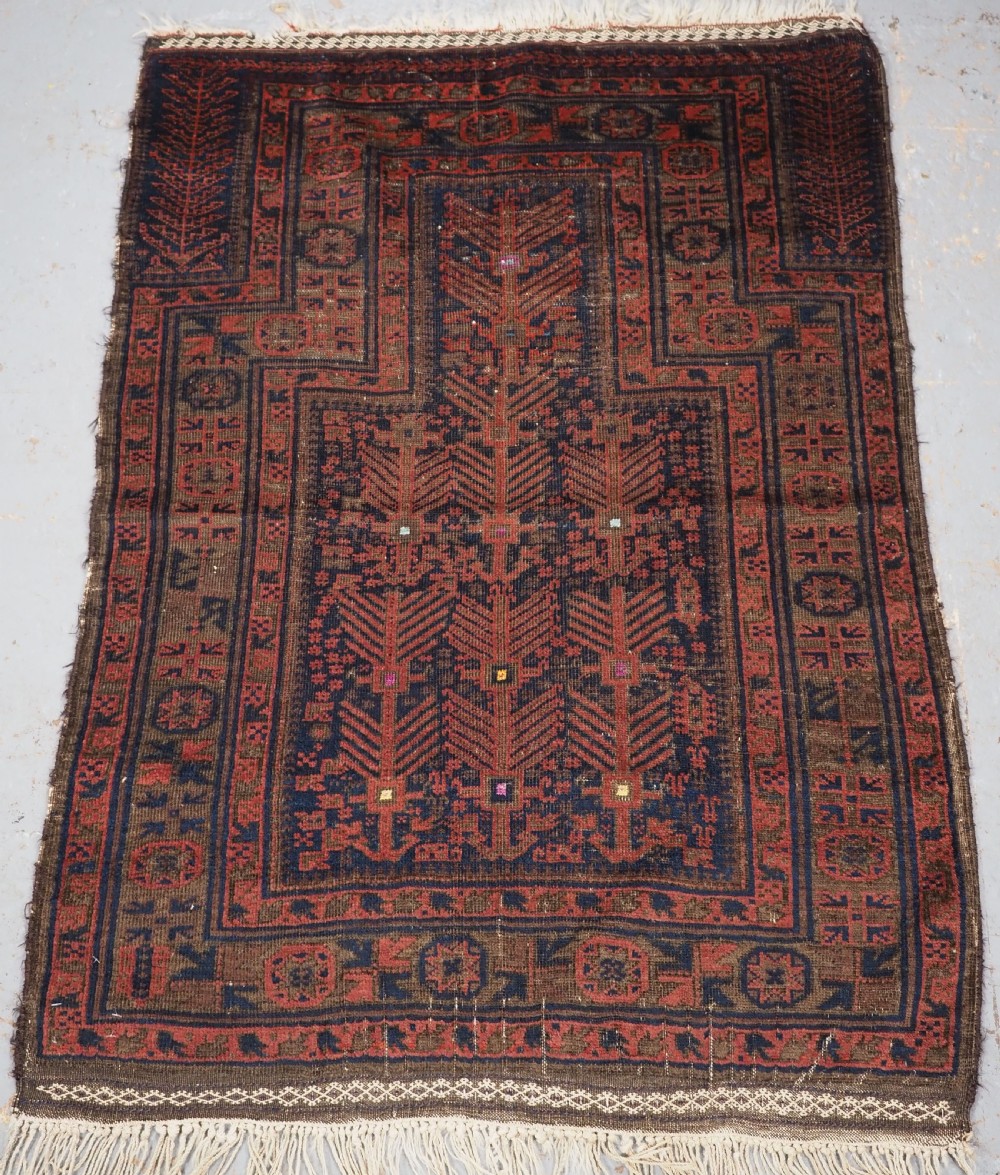 ANTIQUE TIMURI BALUCH PRAYER RUG WITH BLUE GROUND & SILK HIGHLIGHTS, CIRCA 1880.
