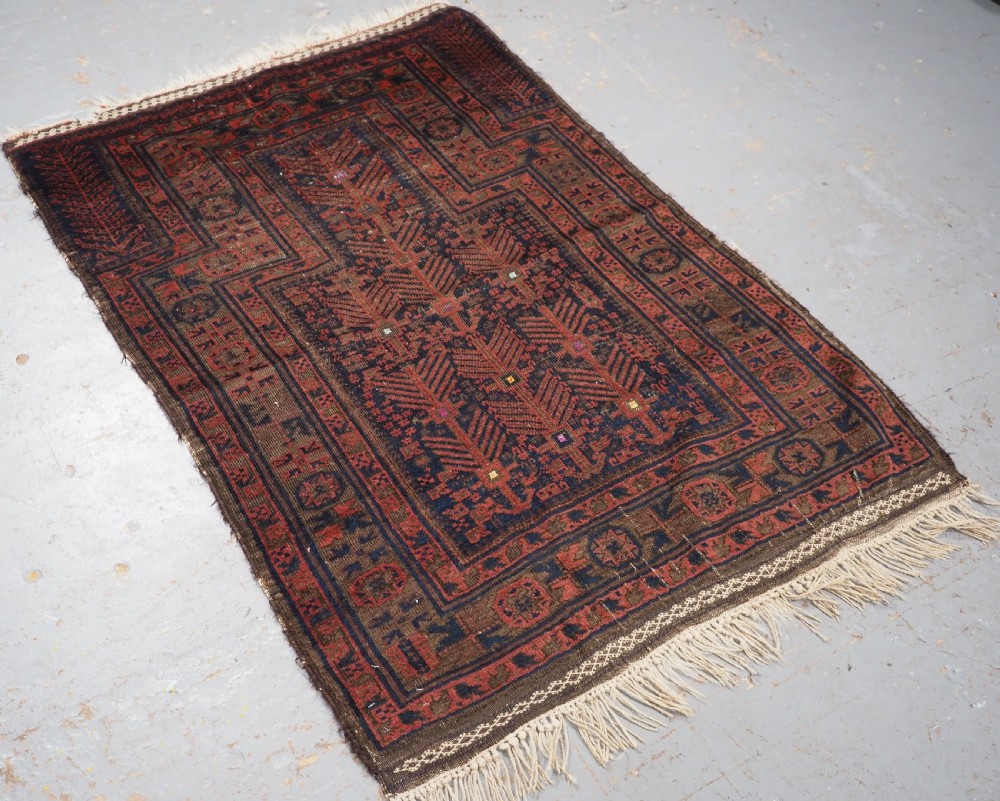 ANTIQUE TIMURI BALUCH PRAYER RUG WITH BLUE GROUND & SILK HIGHLIGHTS, CIRCA 1880. View II