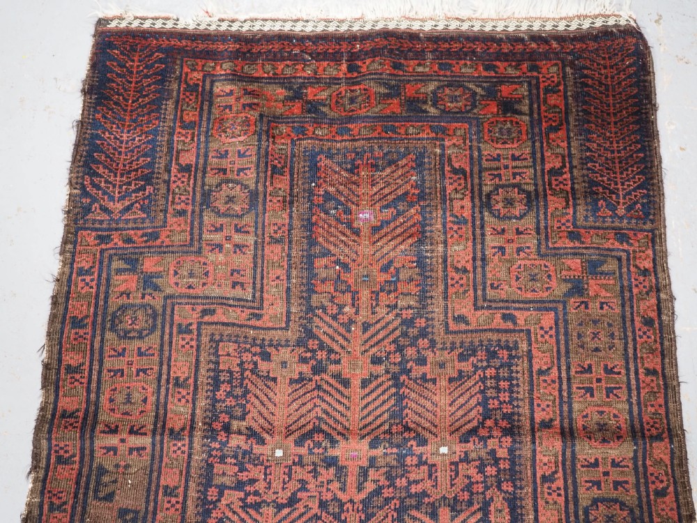 ANTIQUE TIMURI BALUCH PRAYER RUG WITH BLUE GROUND & SILK HIGHLIGHTS, CIRCA 1880. View III