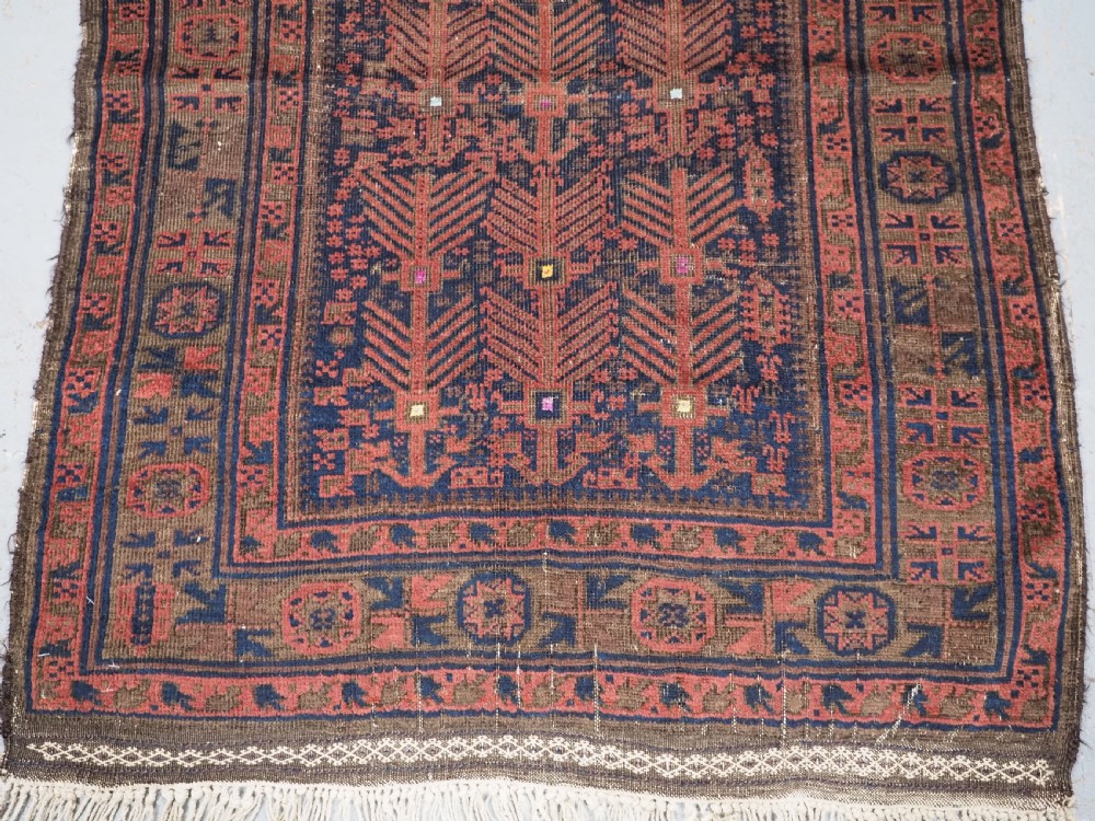 ANTIQUE TIMURI BALUCH PRAYER RUG WITH BLUE GROUND & SILK HIGHLIGHTS, CIRCA 1880. View V