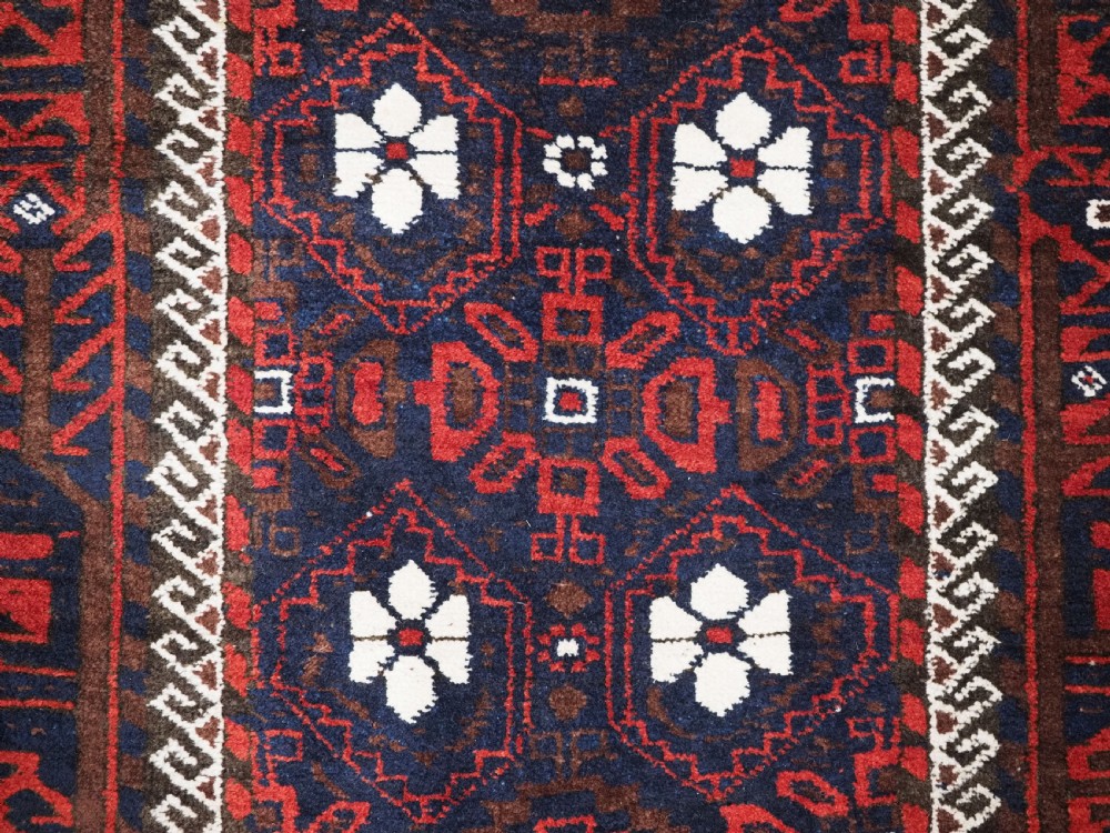 ANTIQUE BALUCH RUG WITH MINA KHANI DESIGN, CIRCA 1900. View X