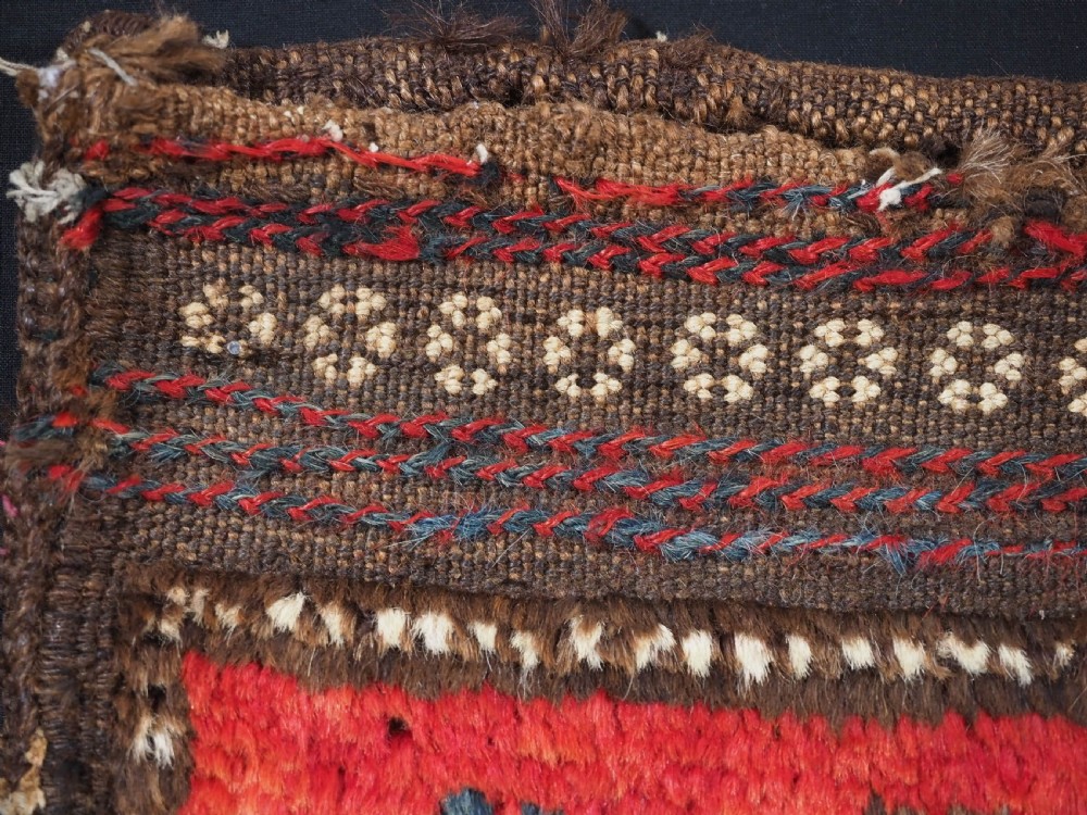 ANTIQUE AFGHAN BALUCH VANITY BAG WITH PLAIN WEAVE BACK, CIRCA 1920. View VII