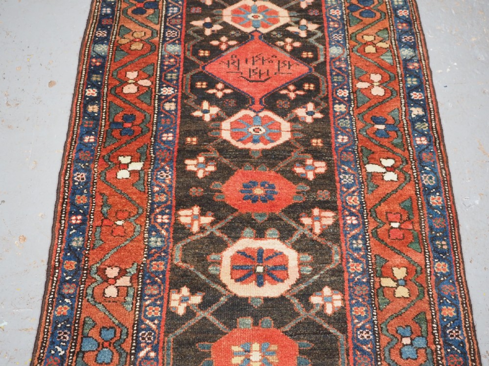 ANTIQUE NARROW RUNNER WITH MINA KHANI DESIGN, HAMADAN REGION, CIRCA 1900. View V