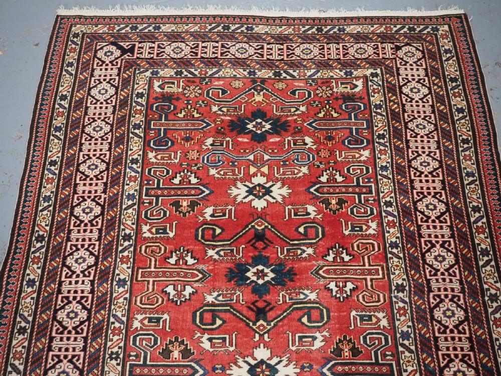 ANTIQUE CAUCASIAN KUBA PEREPEDIL RUG WITH SOFT RED GROUND, CIRCA 1900. View III