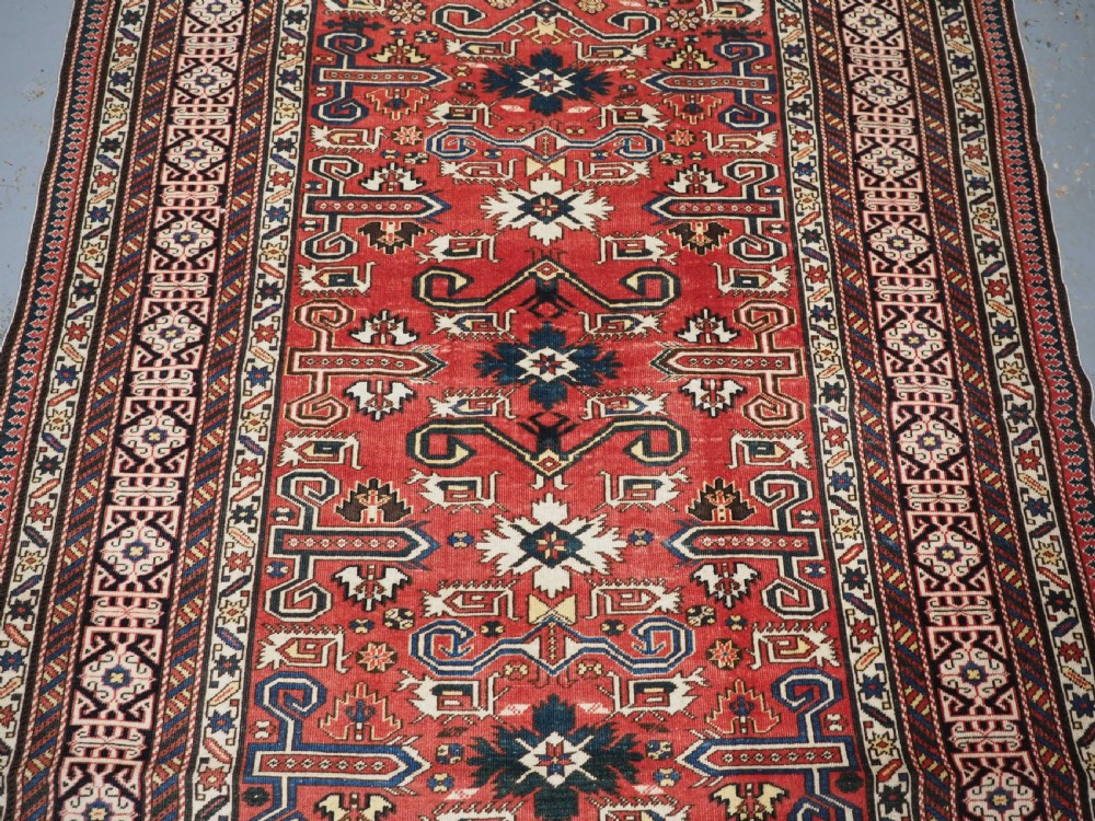 ANTIQUE CAUCASIAN KUBA PEREPEDIL RUG WITH SOFT RED GROUND, CIRCA 1900. View IV