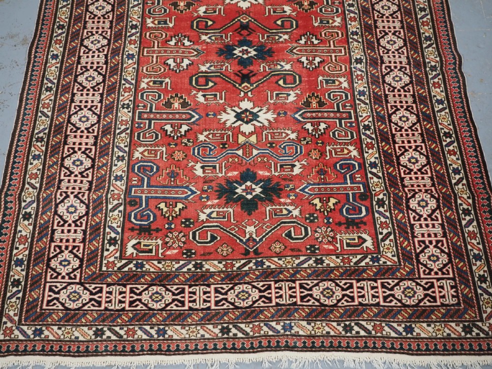 ANTIQUE CAUCASIAN KUBA PEREPEDIL RUG WITH SOFT RED GROUND, CIRCA 1900. View V