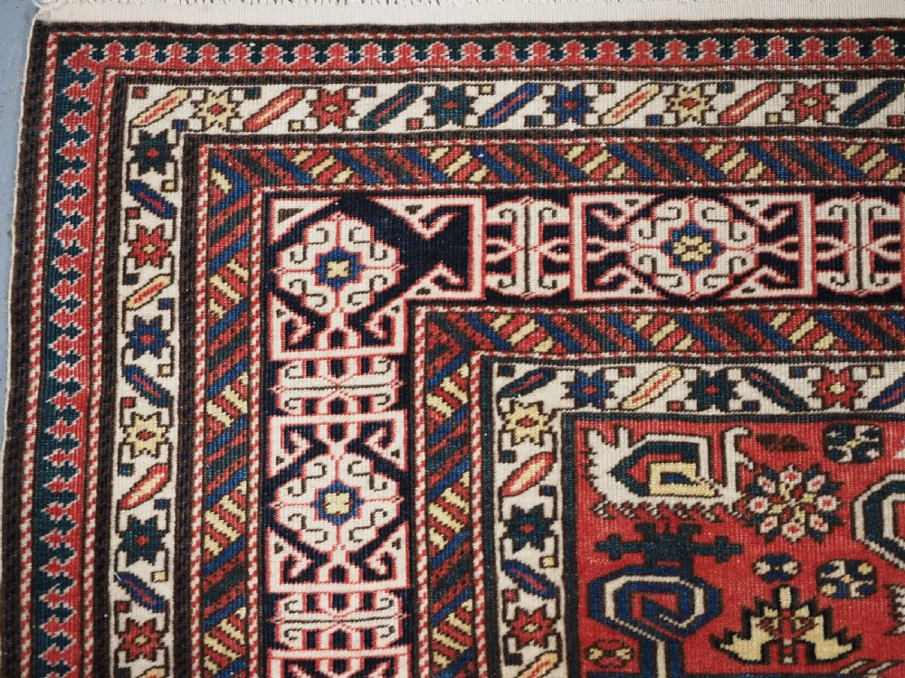 ANTIQUE CAUCASIAN KUBA PEREPEDIL RUG WITH SOFT RED GROUND, CIRCA 1900. View VI