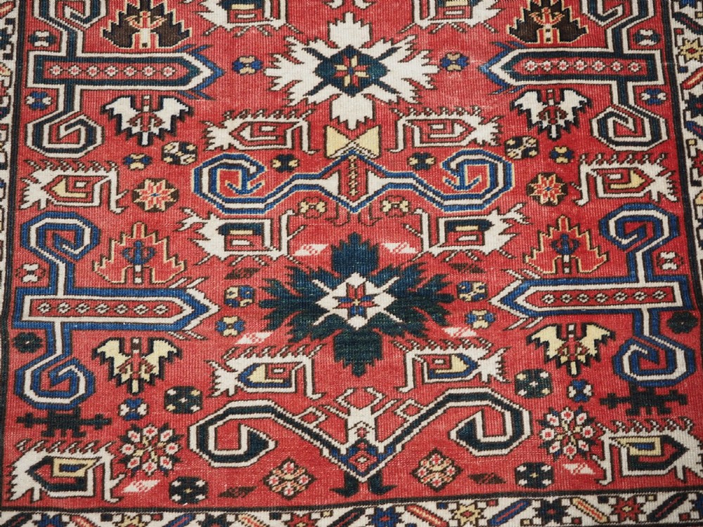 ANTIQUE CAUCASIAN KUBA PEREPEDIL RUG WITH SOFT RED GROUND, CIRCA 1900. View X