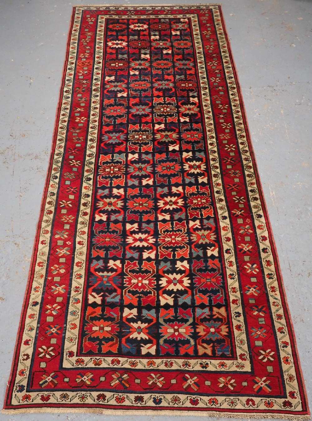 ANTIQUE CAUCASIAN KARABAGH LONG RUG / RUNNER WITH ALL OVER DESIGN, CIRCA 1920.