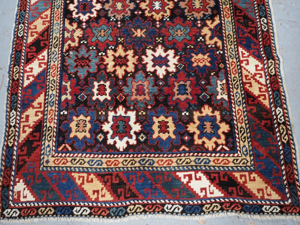 ANTIQUE CAUCASIAN DAGESTAN RUG WITH BLOSSOM DESIGN, CIRCA 1880. View V