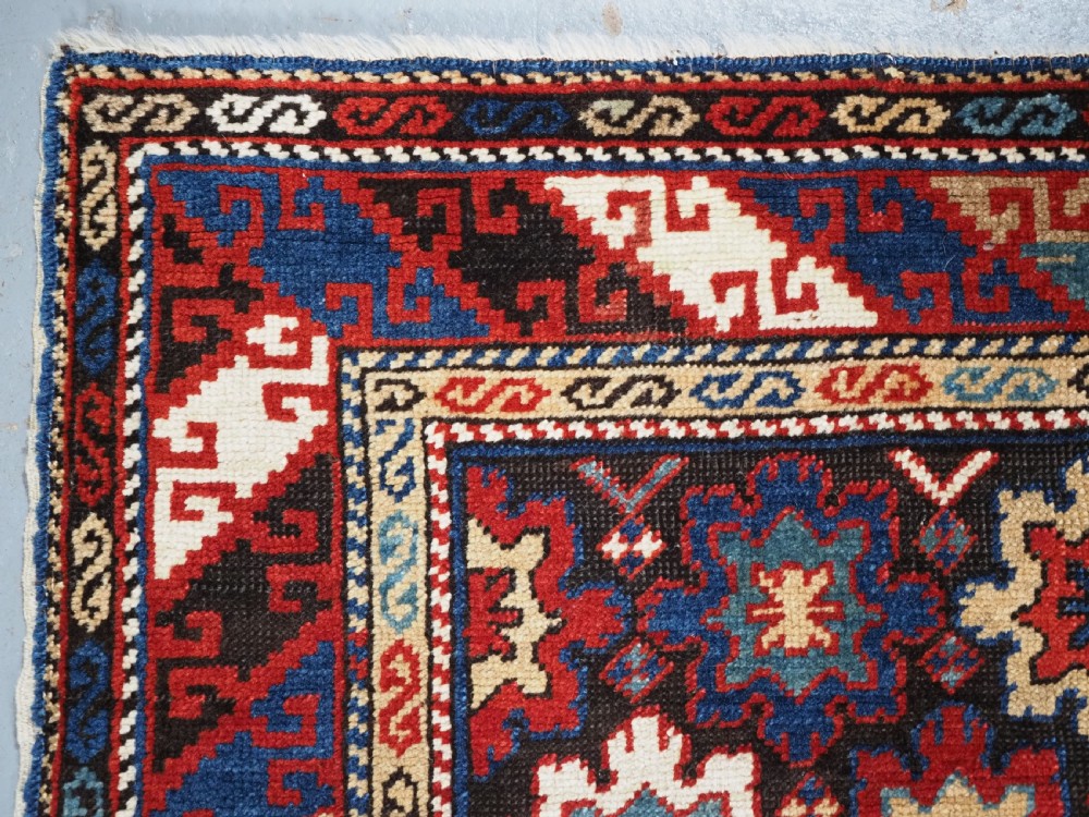 ANTIQUE CAUCASIAN DAGESTAN RUG WITH BLOSSOM DESIGN, CIRCA 1880. View VI
