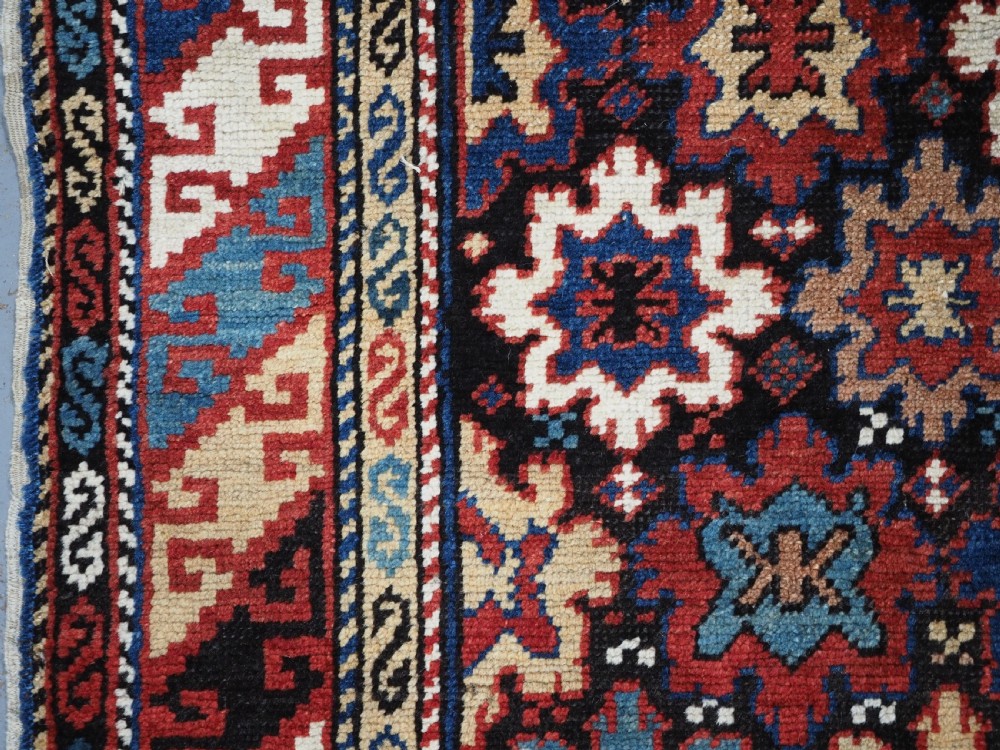 ANTIQUE CAUCASIAN DAGESTAN RUG WITH BLOSSOM DESIGN, CIRCA 1880. View VII