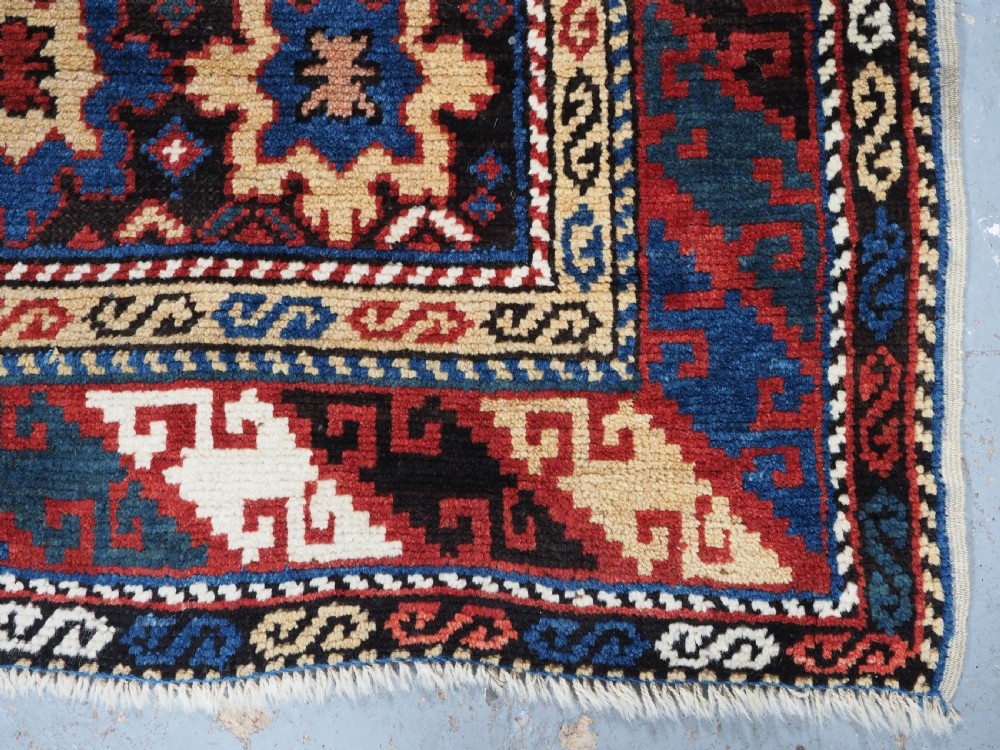 ANTIQUE CAUCASIAN DAGESTAN RUG WITH BLOSSOM DESIGN, CIRCA 1880. View XI
