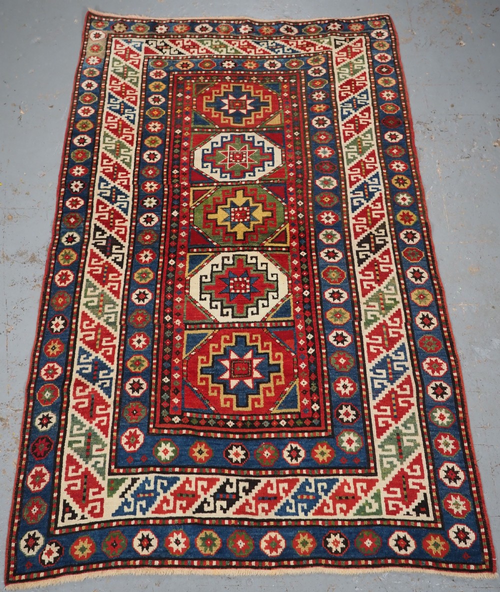 ANTIQUE CAUCASIAN KAZAK RUG WITH 'MEMLINC' GUL DESIGN, CIRCA 1890.