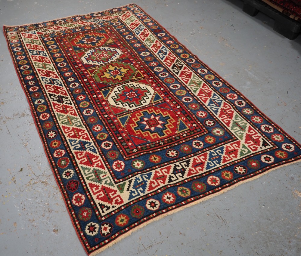 ANTIQUE CAUCASIAN KAZAK RUG WITH 'MEMLINC' GUL DESIGN, CIRCA 1890. View II
