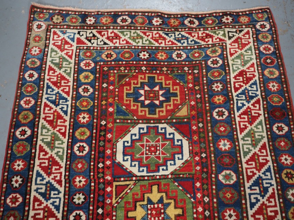 ANTIQUE CAUCASIAN KAZAK RUG WITH 'MEMLINC' GUL DESIGN, CIRCA 1890. View III