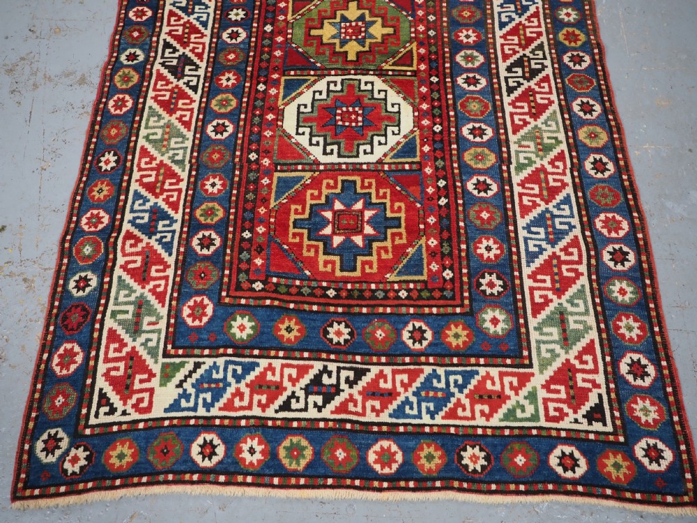 ANTIQUE CAUCASIAN KAZAK RUG WITH 'MEMLINC' GUL DESIGN, CIRCA 1890. View V