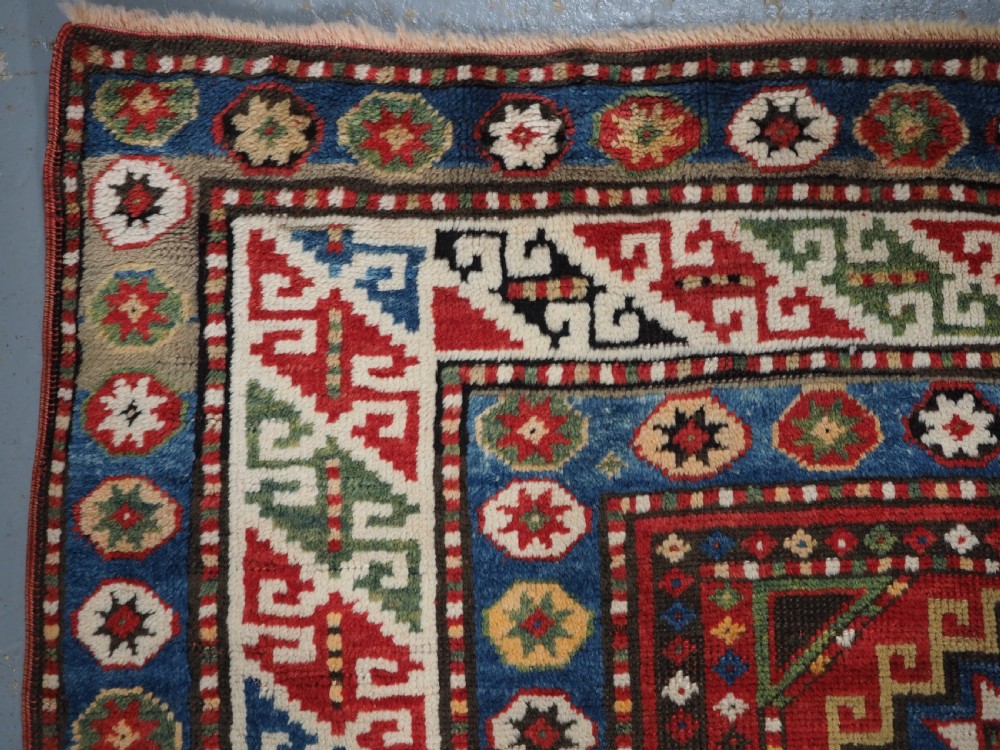 ANTIQUE CAUCASIAN KAZAK RUG WITH 'MEMLINC' GUL DESIGN, CIRCA 1890. View VI