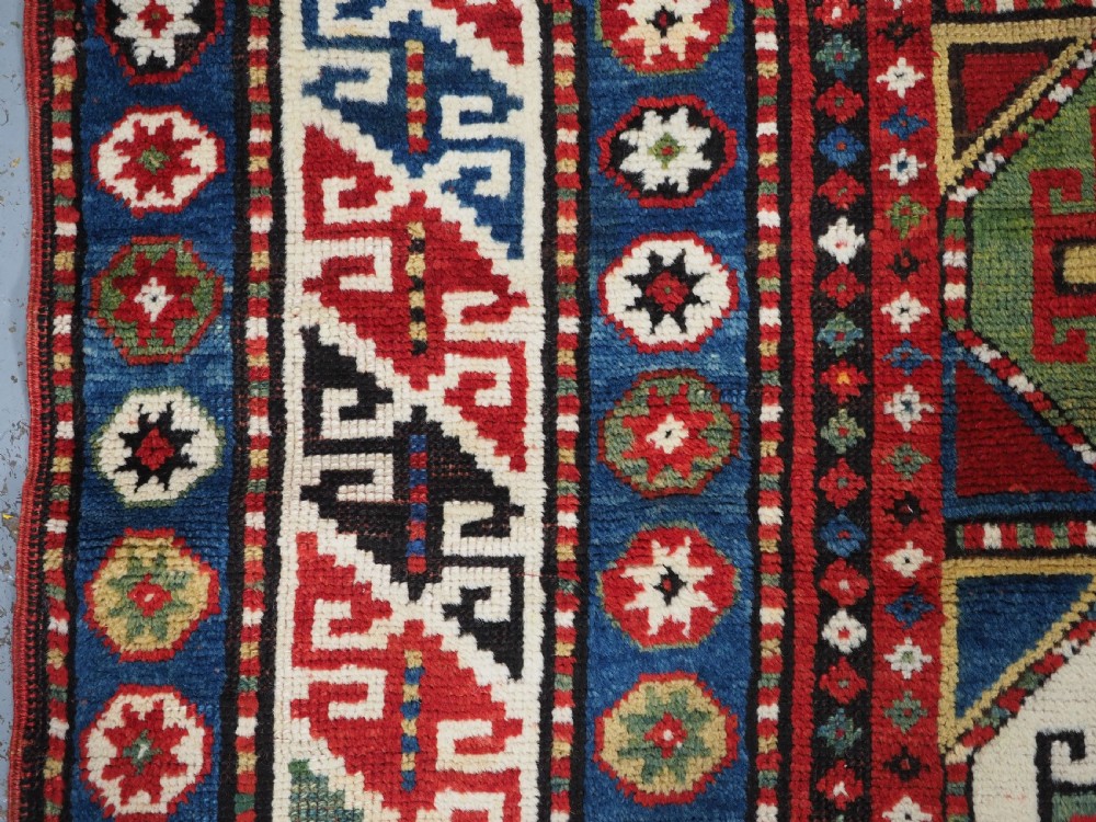 ANTIQUE CAUCASIAN KAZAK RUG WITH 'MEMLINC' GUL DESIGN, CIRCA 1890. View VII