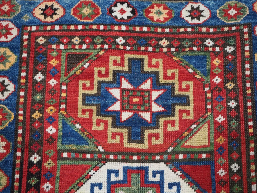 ANTIQUE CAUCASIAN KAZAK RUG WITH 'MEMLINC' GUL DESIGN, CIRCA 1890. View VIII
