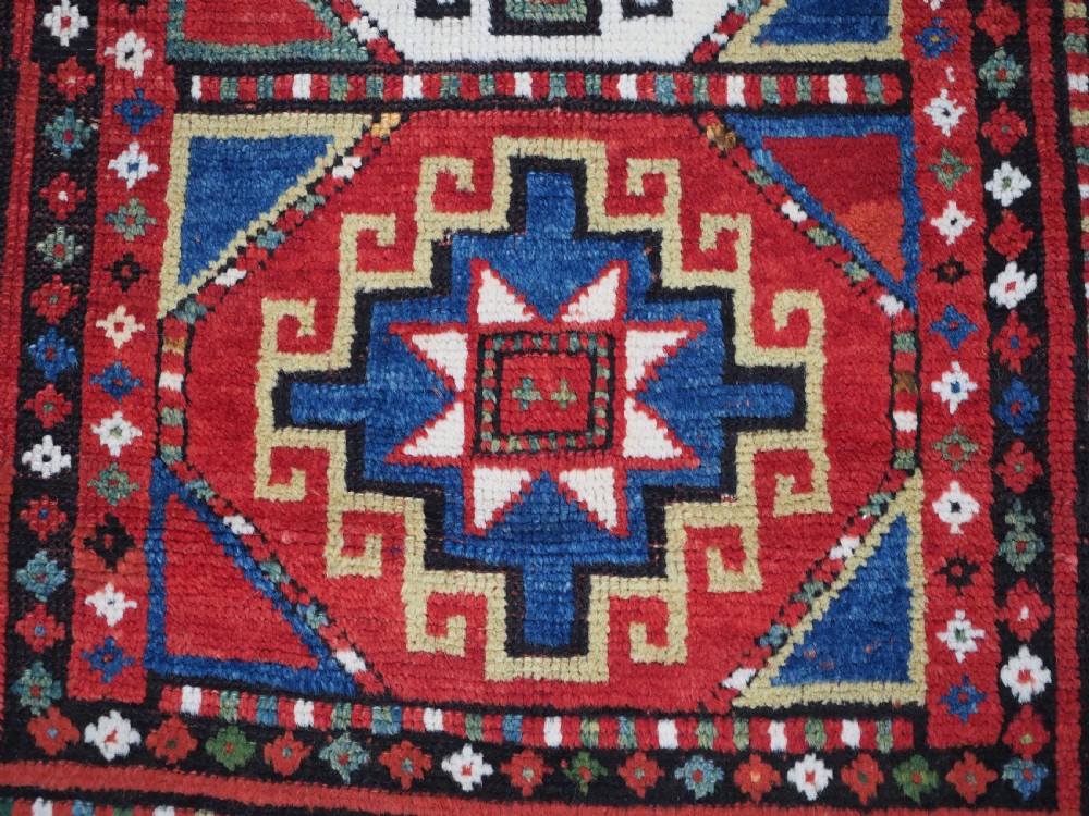 ANTIQUE CAUCASIAN KAZAK RUG WITH 'MEMLINC' GUL DESIGN, CIRCA 1890. View XI