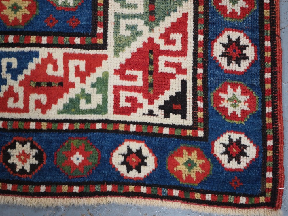 ANTIQUE CAUCASIAN KAZAK RUG WITH 'MEMLINC' GUL DESIGN, CIRCA 1890. View XII