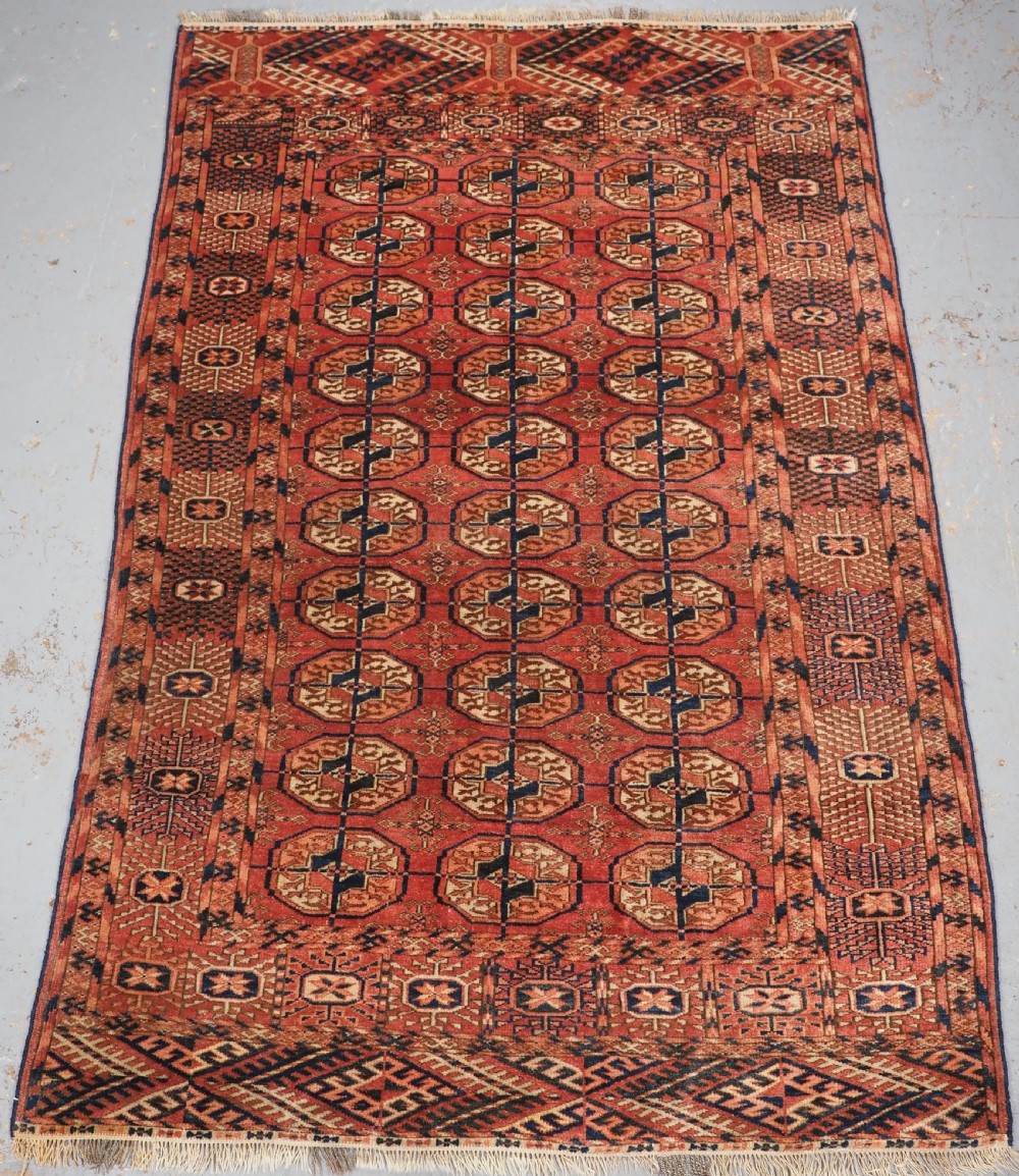 ANTIQUE TEKKE TURKMEN 'DIP KHALI' RUG, SOFT WARM RED COLOUR, CIRCA 1900.