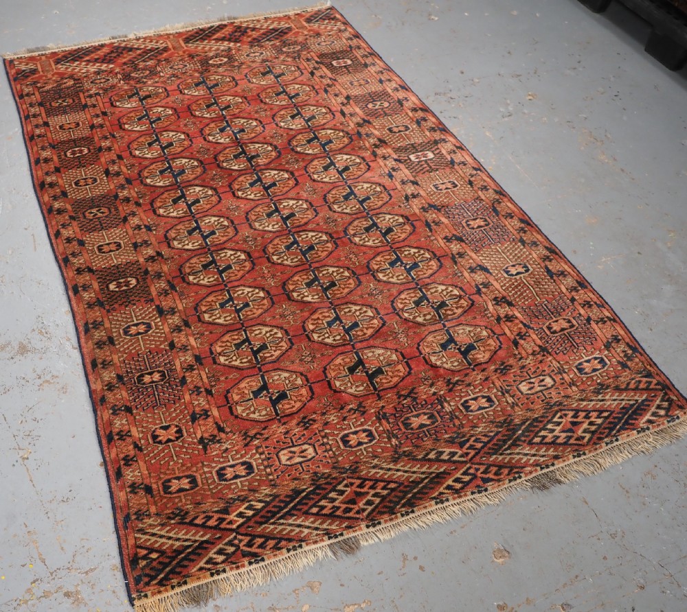ANTIQUE TEKKE TURKMEN 'DIP KHALI' RUG, SOFT WARM RED COLOUR, CIRCA 1900. View II