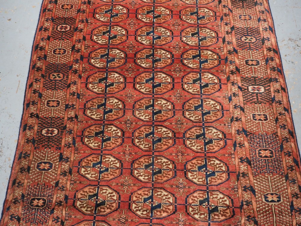 ANTIQUE TEKKE TURKMEN 'DIP KHALI' RUG, SOFT WARM RED COLOUR, CIRCA 1900. View IV