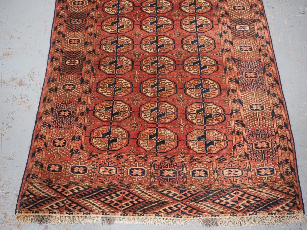 ANTIQUE TEKKE TURKMEN 'DIP KHALI' RUG, SOFT WARM RED COLOUR, CIRCA 1900. View V
