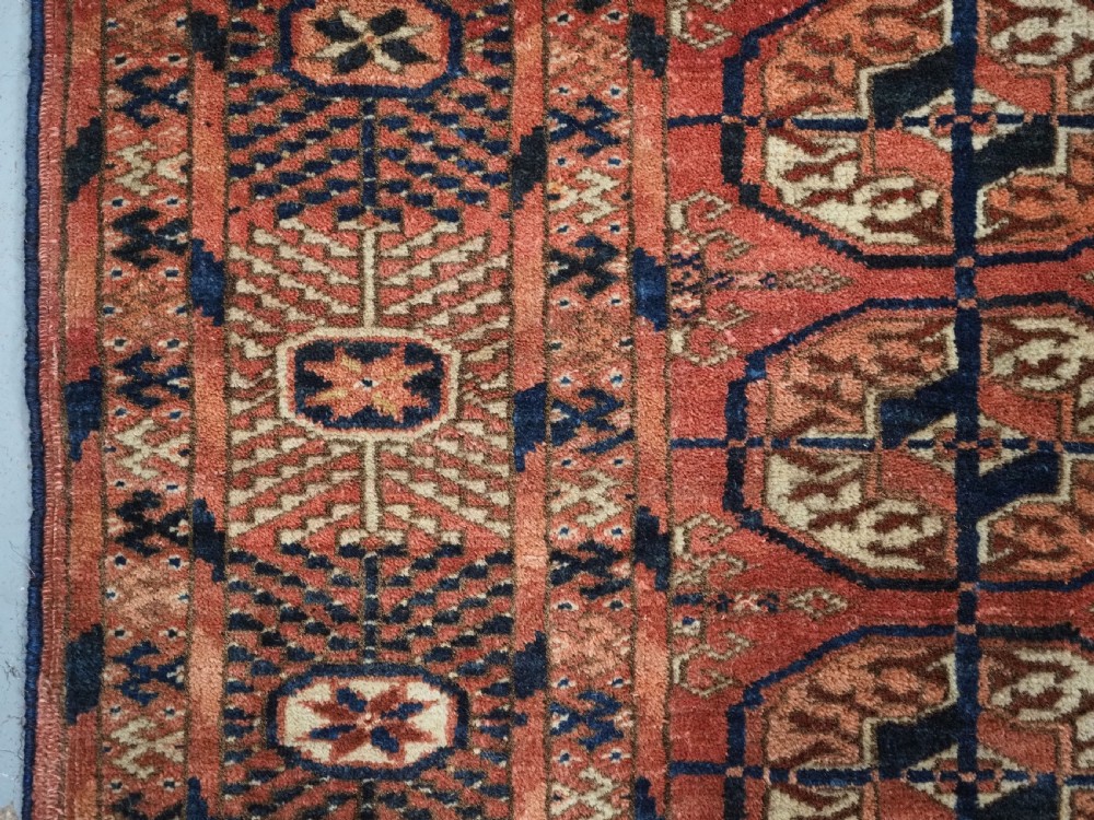ANTIQUE TEKKE TURKMEN 'DIP KHALI' RUG, SOFT WARM RED COLOUR, CIRCA 1900. View VII