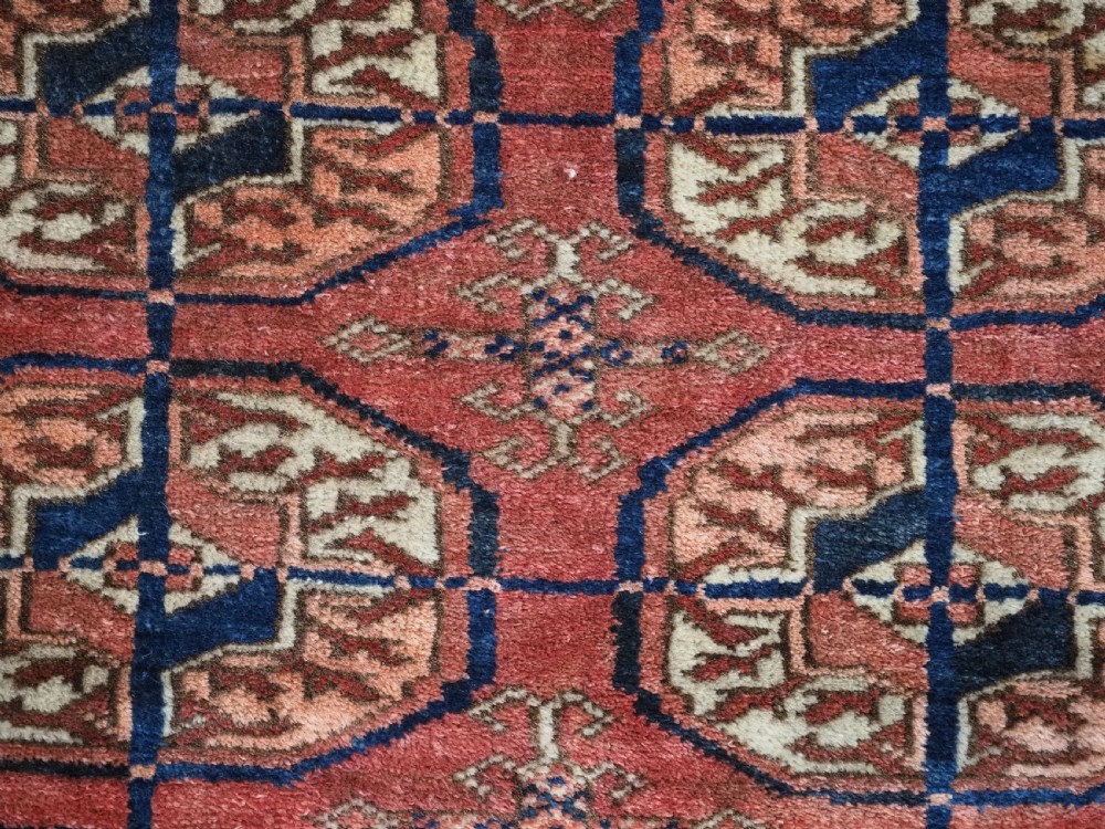 ANTIQUE TEKKE TURKMEN 'DIP KHALI' RUG, SOFT WARM RED COLOUR, CIRCA 1900. View X