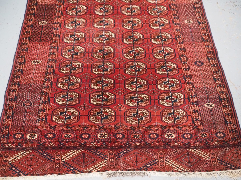 ANTIQUE TEKKE TURKMEN RUG WITH WARM RED COLOUR, CIRCA 1900. View V