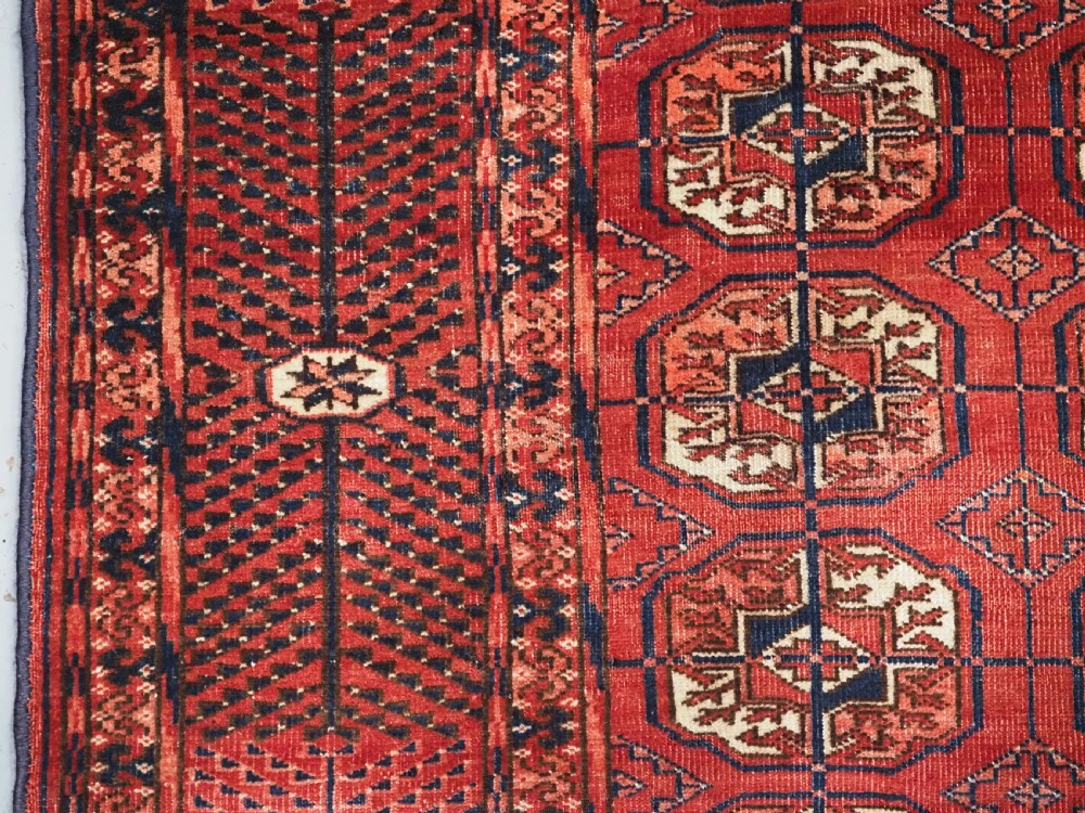 ANTIQUE TEKKE TURKMEN RUG WITH WARM RED COLOUR, CIRCA 1900. View VII