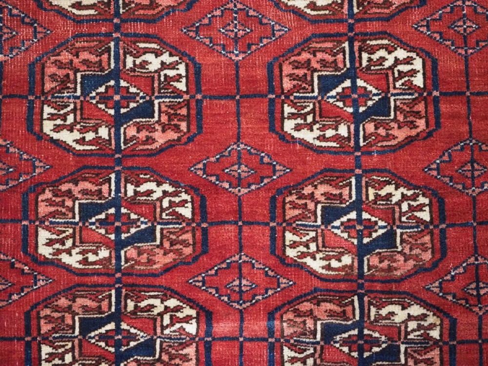 ANTIQUE TEKKE TURKMEN RUG WITH WARM RED COLOUR, CIRCA 1900. View IX