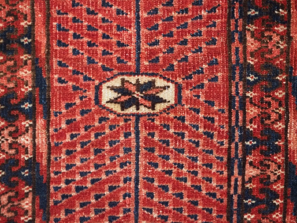 ANTIQUE TEKKE TURKMEN RUG WITH WARM RED COLOUR, CIRCA 1900. View X