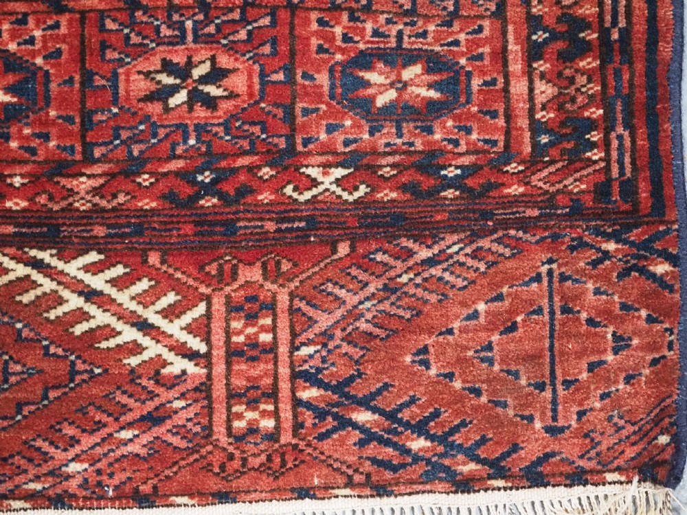 ANTIQUE TEKKE TURKMEN RUG WITH WARM RED COLOUR, CIRCA 1900. View XII