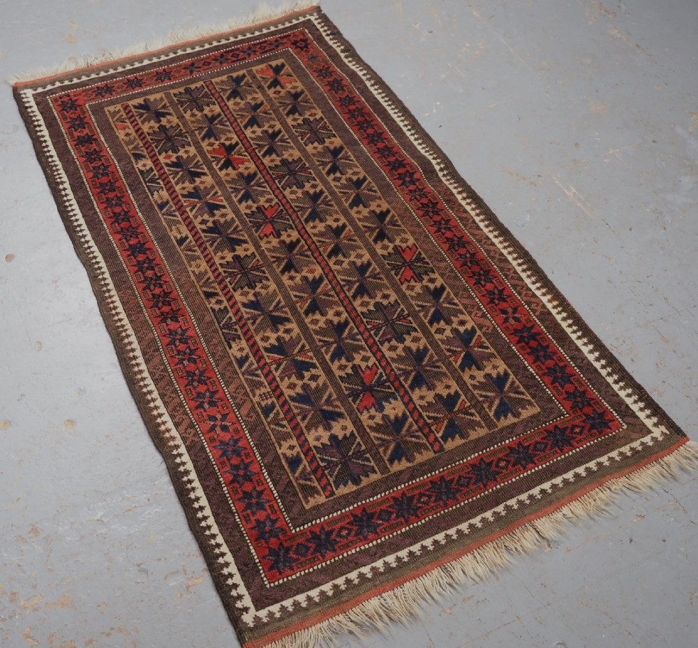 ANTIQUE BALUCH RUG WITH REPEAT LOTUS LEAF DESIGN, CIRCA 1900. View II