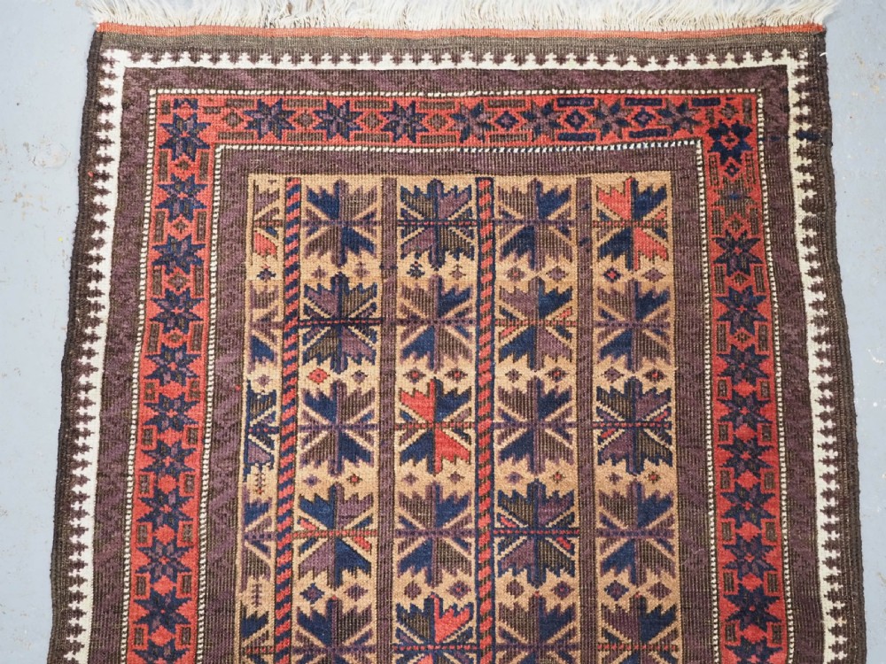 ANTIQUE BALUCH RUG WITH REPEAT LOTUS LEAF DESIGN, CIRCA 1900. View III