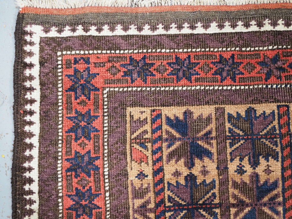 ANTIQUE BALUCH RUG WITH REPEAT LOTUS LEAF DESIGN, CIRCA 1900. View V