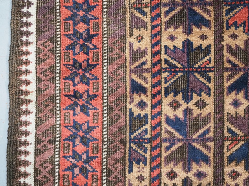 ANTIQUE BALUCH RUG WITH REPEAT LOTUS LEAF DESIGN, CIRCA 1900. View VII