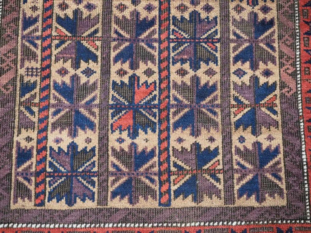 ANTIQUE BALUCH RUG WITH REPEAT LOTUS LEAF DESIGN, CIRCA 1900. View X