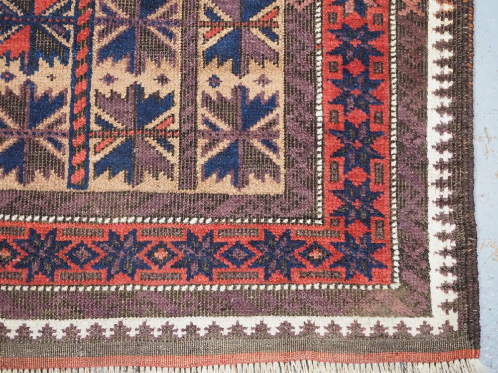 ANTIQUE BALUCH RUG WITH REPEAT LOTUS LEAF DESIGN, CIRCA 1900. View XI